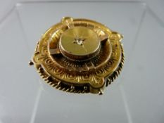 A VICTORIAN FIFTEEN CARAT GOLD BROOCH with centrally set diamond, 6.5 grms gross