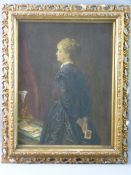 A GILT FRAMED OILIOGRAPH - interior scene of young girl, possibly newly widowed with