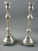 JUDAICA SILVER SABBATH CANDLESTICKS, a pair of typical baluster form holders with embossed floral