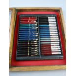 A COLLECTION OF FORTY PARKER FOUNTAIN PENS in an oak display case to include eleven Duofold, one