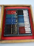 A COLLECTION OF FORTY PARKER FOUNTAIN PENS in an oak display case to include eleven Duofold, one