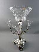 A WALKER & HALL ELECTROPLATED TABLE CENTREPIECE, the segmented trefoil base with shell foot and