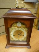 A REPRODUCTION MAHOGANY CHIMING BRACKET CLOCK the brass and silvered dial marked Tempus Fugit