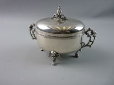 A CONTINENTAL WHITE METAL SUGAR BOX AND COVER, the hinged and engraved lid with Rococo finial,