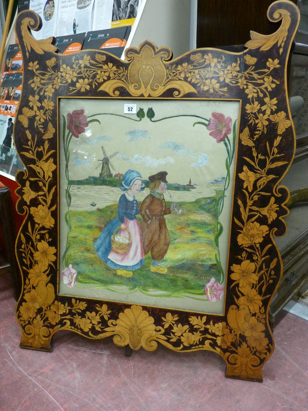 A STENCIL DECORATION FAUX INLAY FIRESCREEN, an easel style frame shaped and decoration with flowers,