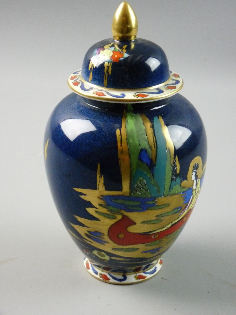 AN ARCADIAN WARE BLUE LAGOON JAR AND COVER, 18.5 cms overall height with Art Deco style enamel and