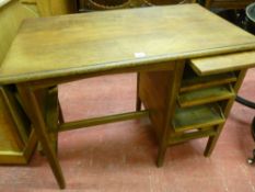 A VINTAGE OAK MULTI-FUNCTIONAL DESK with single side flap and drop down tray, slide-out interior