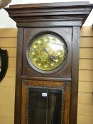 A GUSTAV BECKER ART NOUVEAU OAK LONGCASE CLOCK, the circular brass dial with raised stylized Arabic