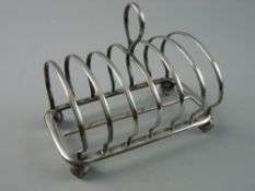A SIX SECTION SILVER TOAST RACK on corner ball feet, 9.7 troy ozs, Sheffield 1867, maker possibly
