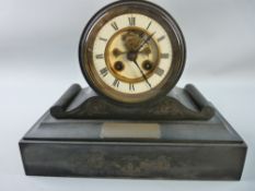 A VICTORIAN BLACK SLATE MANTEL CLOCK with drum shaped top, white enamel outer dial set with Roman