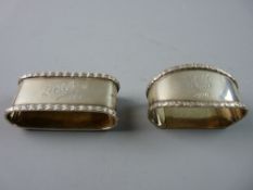 TWO OVAL SILVER NAPKIN RINGS, Chester 1915 and London 1917, 2 troy ozs, each monogrammed and dated