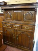 AN 18th CENTURY OAK DEUDDARN, the moulded cornice over inverted forward finials to the upper section