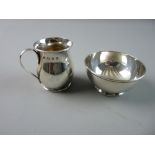 A MINIATURE SILVER CREAM JUG AND SUGAR BASIN each of plain form, the bowl on a slightly raised