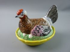 A LATE 19th CENTURY STAFFORDSHIRE POTTERY HEN ON NEST, well preserved with good colouring, the