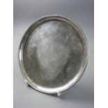 A GEORGE III SILVER CARD TRAY, 17.75 cms diameter with beadwork border and floral engraved tray on