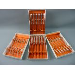 A TWENTY FOUR PIECE SET OF SILVER/PART SILVER CUTLERY contained in four boxes - six dinner forks, 13