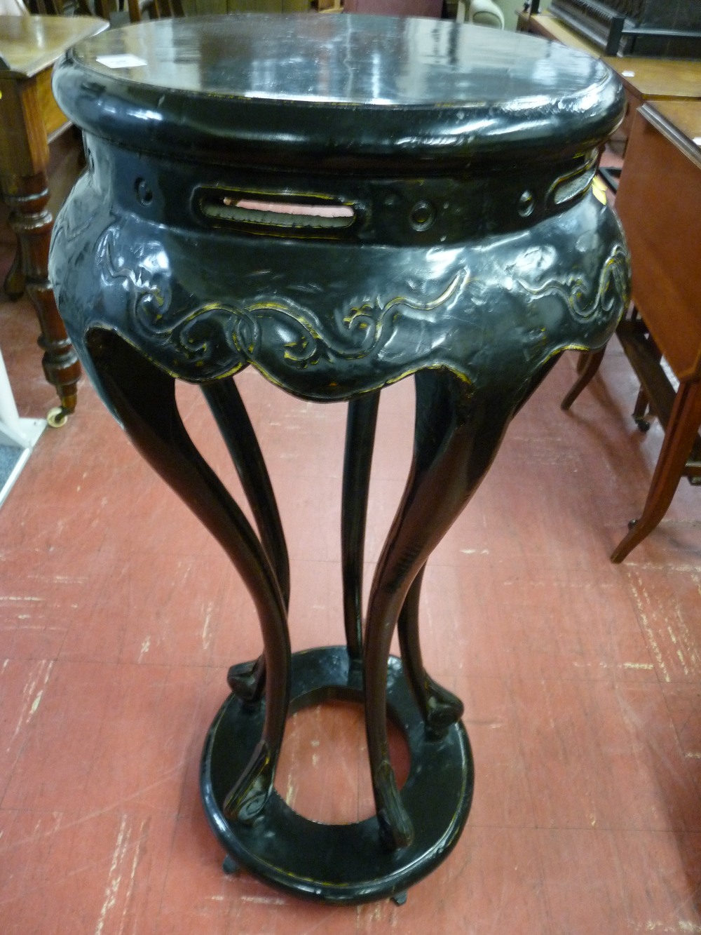 A CIRCULAR PEDESTAL STAND in the Oriental style on five swept supports on an open circular base,