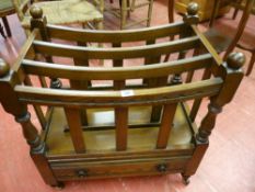 A REPRODUCTION OAK CANTERBURY, curved sectional top with lower drawer on turned and block supports