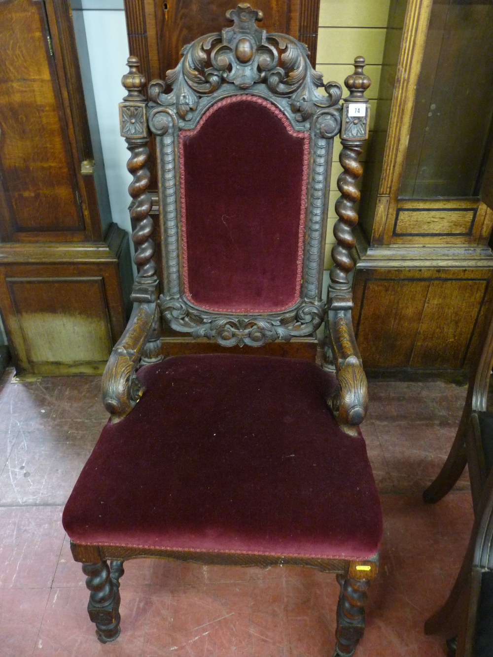 A 19th CENTURY JACOBEAN STYLE ARMCHAIR, carved oak with leaf and cartouche top rail, barley twist