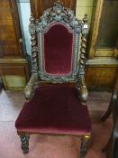 A 19th CENTURY JACOBEAN STYLE ARMCHAIR, carved oak with leaf and cartouche top rail, barley twist