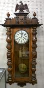 A CIRCA 1900 VIENNA STYLE WALNUT CASED WALL CLOCK, twin weight with pendulum, the enamel dial marked