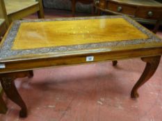 A MODERN HARDWOOD BRASS INLAID COFFEE TABLE, the rectangular top with floral carved border, the