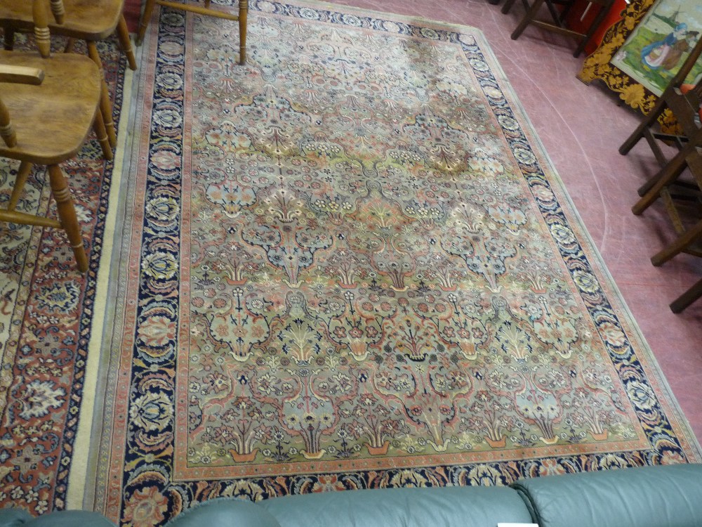 A LARGE MID 20th CENTURY PURE NEW WOOL CARPET with tasselled ends and all over floral repeat