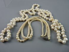 TWO SINGLE ROW PEARL NECKLACES, a 57 cms graduated knotted strand with silver and marcasite clasp