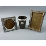 TWO SILVER MOUNTED PHOTOGRAPH FRAMES and a horn beaker with silver rim, the beaker mounted with a