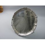 A SILVER LETTER TRAY having a beadwork and floral border with crest and presentation inscription,