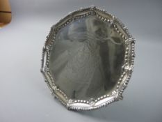A SILVER LETTER TRAY having a beadwork and floral border with crest and presentation inscription,