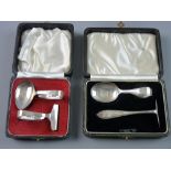 TWO BOXED SILVER SPOON AND PUSHER SETS, 1 troy oz, Sheffield 1957 and 1959 and 1.2 troy ozs,