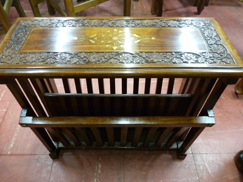 A MODERN HARDWOOD BRASS INLAID MAGAZINE TABLE, the rectangular top with carved floral border, 44 cms