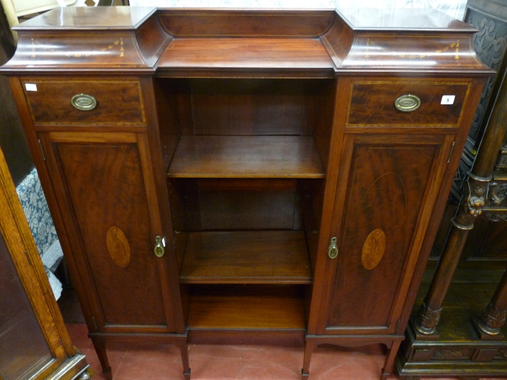 AN INLAID MAHOGANY SHERATON STYLE URN CABINET/BOOKCASE having a shaped platform top with drop down