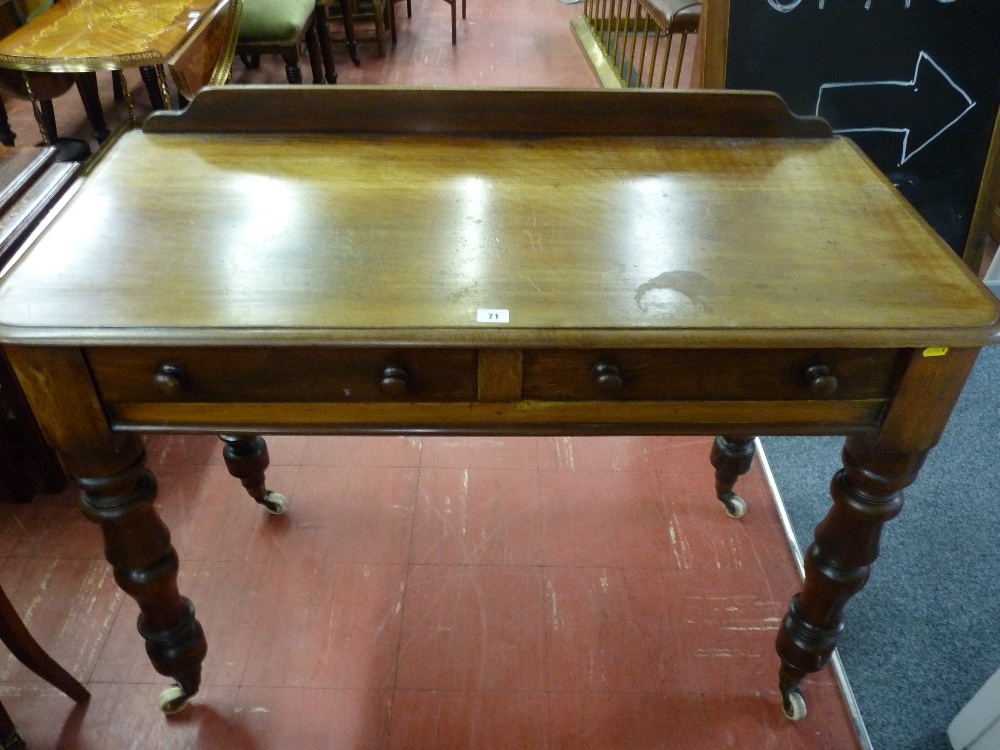 A VICTORIAN MAHOGANY RAILBACK SIDE TABLE, the moulded top over two frieze drawers with turned wooden