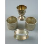 A PAIR OF VERY HEAVY ENGINE TURNED WIDE SILVER NAPKIN RINGS, 6 ozs, Birmingham 1913 and a silver