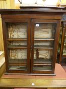 A NEAT VICTORIAN MAHOGANY WALL CABINET with twin glazed doors and adjustable interior shelves, 81.