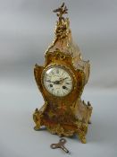 A FRENCH VERNIS MARTIN STYLE MANTEL CLOCK, balloon gilt decorated case, hand painted floral sprays