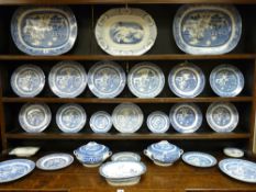 A QUANTITY OF WILLOW PATTERN BLUE AND WHITE DINNERWARE as displayed on the dresser (Lot 50), to