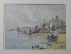 JOSEPH HUGHES CLAYTON watercolour and mixed media - cottages at Cemaes, Anglesey with numerous boats