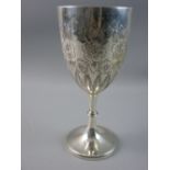 A HALLMARKED SILVER GOBLET having embossed floral and leaf decoration on a knopped pedestal with