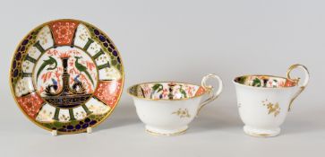 A NANTGARW 'JAPAN' PATTERN TRIO of cups and saucer decorated by Thomas Pardoe in the Imari palette