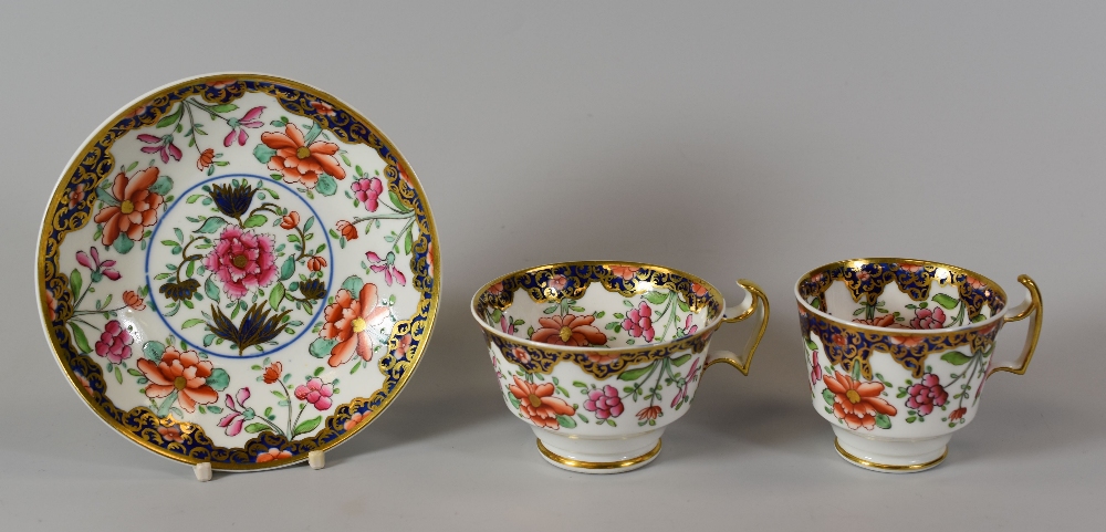 A SWANSEA PORCELAIN ORIENTAL STYLE TRIO with border of gilt foliage and pink flowers on