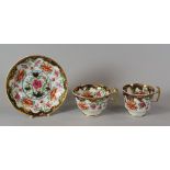 A SWANSEA PORCELAIN ORIENTAL STYLE TRIO with border of gilt foliage and pink flowers on