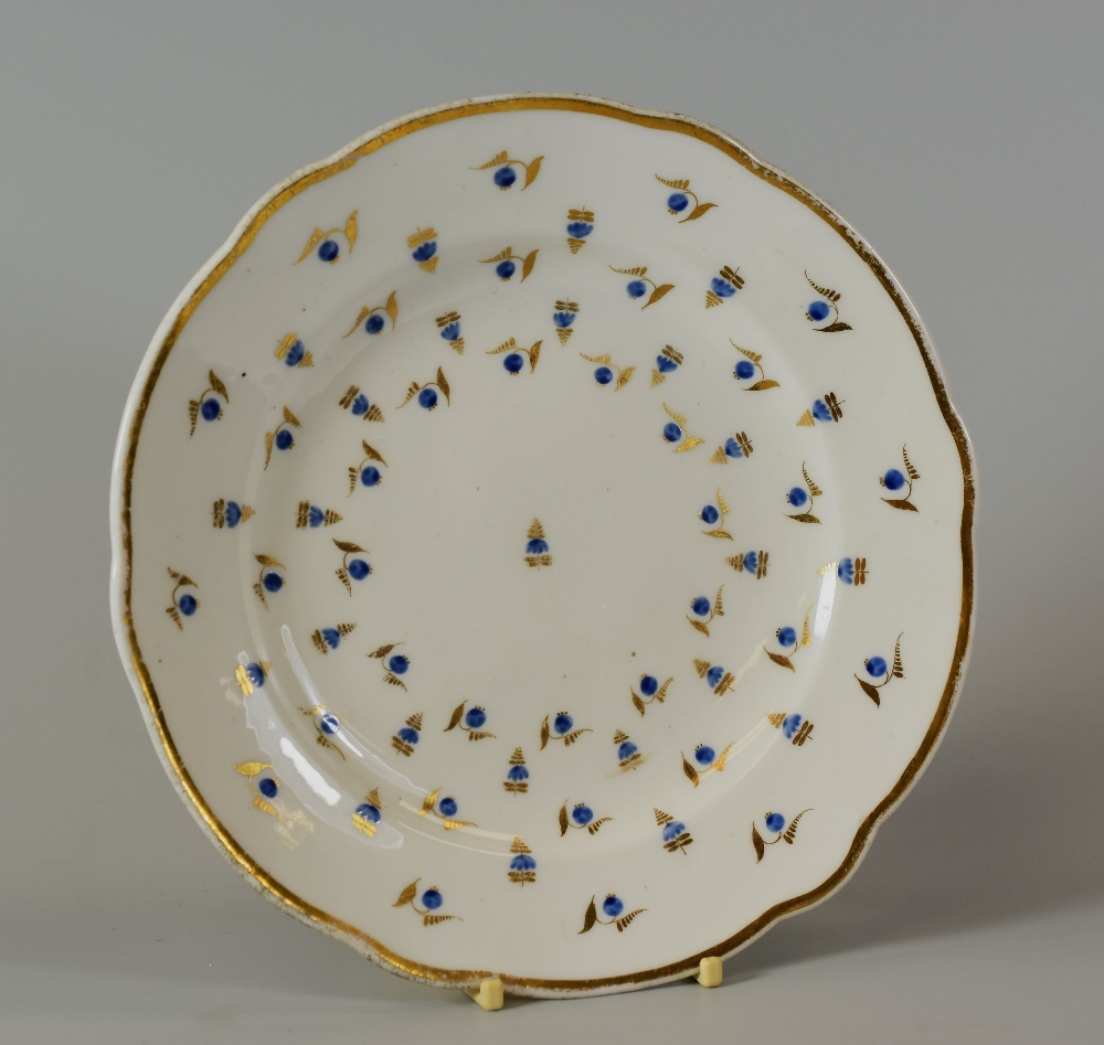 A NANTGARW PORCELAIN 'HENSOL CASTLE' PLATE decorated with blue berries with gilded leaves and with