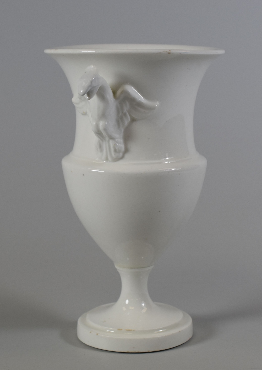 A SWANSEA PORCELAIN UNDECORATED URN VASE with twin eagle-form handles and having a flared rim and - Image 2 of 2