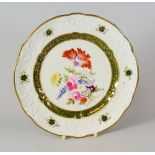 A SWANSEA PORCELAIN DESSERT PLATE finely decorated by Henry Morris with large spray of flowers to