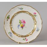 A SWANSEA PORCELAIN DESSERT PLATE with lobed rim and having a moulded border with C-scrolls,