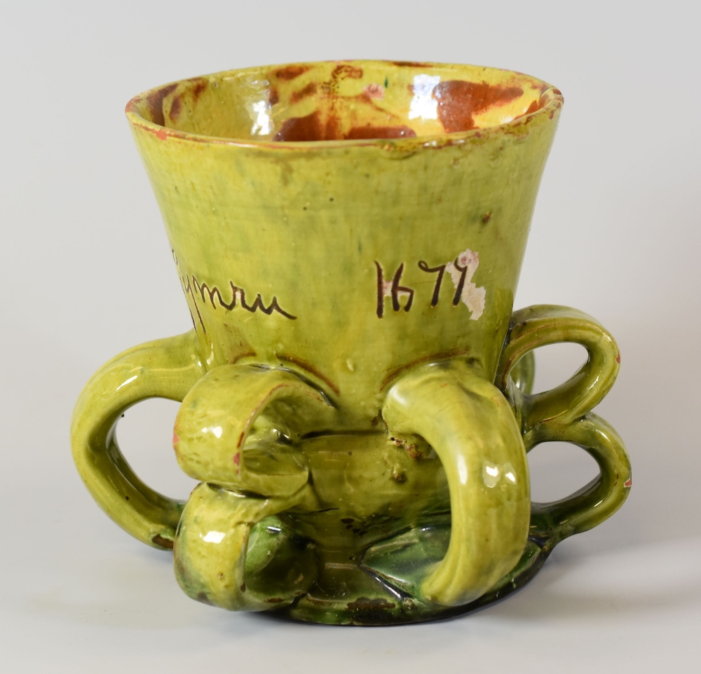 EWENNY POTTERY TYG having three loop handles alternating with three double-loop handles, in green - Image 2 of 2