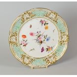 A NANTGARW PORCELAIN LONDON DECORATED PLATE having a lobed rim, the border with finely moulded and